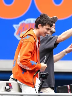 Timothee Chalamet Knicks Victory Parade 2026 Orange Jacket