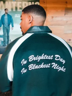 Back view of Aaron Pierre Custom Green Leather Varsity Jacket in vibrant green