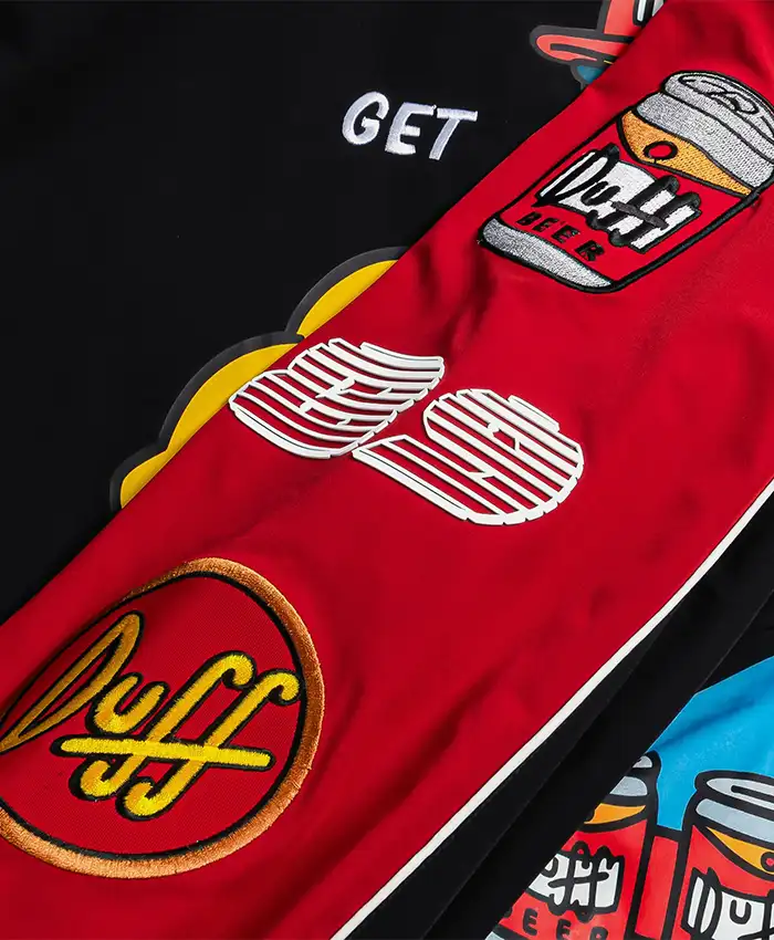Close-up of The Simpsons x Shoe Palace Duff Man Black and Red Bomber Jacket details