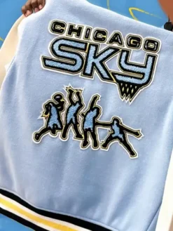 Close-up of WNBA Chicago Sky Limitless Wool Varsity Jacket snap-tab details