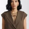 Danielle Olivera Brown Wool Vest featuring lapel collar and belted button closure