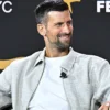 Novak Djokovic Fanatics Fest NYC 2026 Gray Jacket Side View