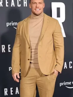 Side profile showing full length sleeves and open hem cuffs of Jack Reacher brown suit