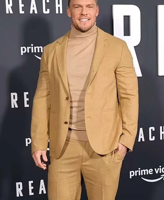 Side profile showing full length sleeves and open hem cuffs of Jack Reacher brown suit