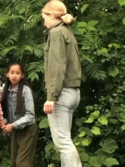 Side view of Willa Fitzgerald Reacher S01 Roscoe Conklin Green Cotton Jacket