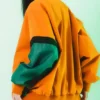Back View of Melinoë Model Hades II Blouson Orange And Green Bomber Jacket
