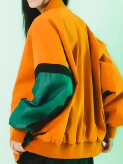 Back View of Melinoë Model Hades II Blouson Orange And Green Bomber Jacket