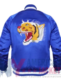 Back view of Katy Perry Tiger Jacket featuring blue satin fabric and bold tiger logo design