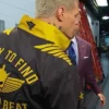 Close-Up of Cody Rhodes Easy To Find Hard To Beat Windbreaker Black And Gold Jacket