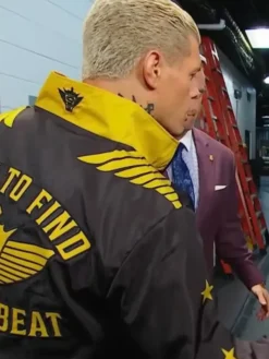 Close-Up of Cody Rhodes Easy To Find Hard To Beat Windbreaker Black And Gold Jacket