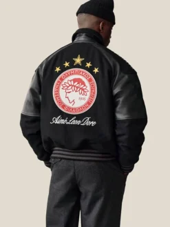 Close-up of Aimé Leon Dore Fall-Winter 2026 Olympiacos F.C. Black Varsity Jacket