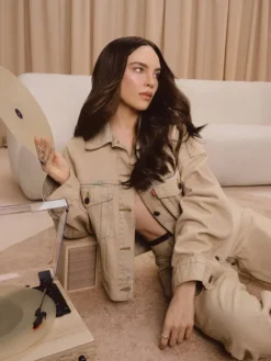 Close-up of Belinda Levi's Beige Denim Trucker Jacket