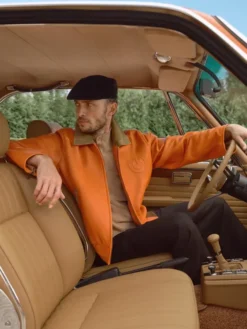 Close-up of Kith for BMW 2026 Orange Leather Hawthorne Flight Workwear Jacket