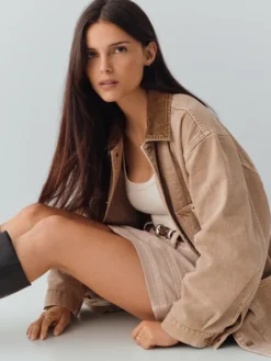 Close-up of Obsession Inde Navarrette x Gap Tan Denim Utility Workwear Jacket