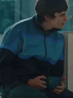 Close-up of Spike Fearn Movie Finding Emily 2026 Owen Brompton Blue Track Bomber Jacket