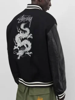 Close-up of Stüssy x eYe Junya Watanabe Man Black Wool Leather Dragon Print Varsity Jacket