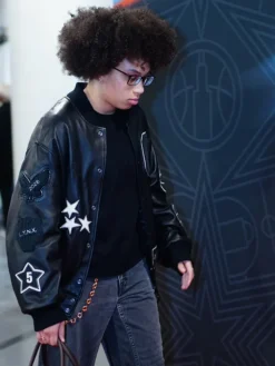 Close-up of WNBA Olivia Miles Coach Black Leather Varsity Jacket