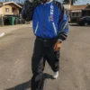 Close view of Corteiz x Grand Theft Auto VI Blue And Black Racing Zip-Up Hooded Jacket