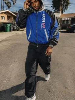 Close view of Corteiz x Grand Theft Auto VI Blue And Black Racing Zip-Up Hooded Jacket