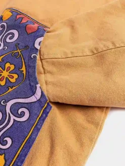 Close view of Disney Aladdin Genie x Shoe Palace Brown And Blue Corduroy Collar Workwear Jacket