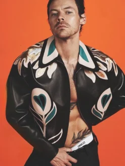 Close view of Harry Styles Custom White And Teal Floral Appliqué Patches Miu Miu Leather Jacket