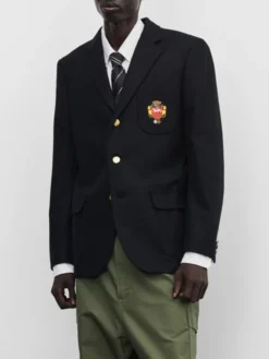 Close view of Stüssy x eYe Junya Watanabe Man Black Venus Swirl Suiting Fabric Blazer Jacket