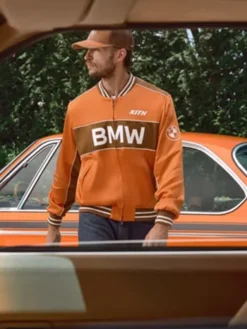 Kith for BMW 2026 Captain Orange Satin Varsity Bomber Jacket front view