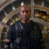 Movie Straight Shot 2026 Tyrese Gibson Black Parachute Military Vest front view
