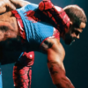 TNA-Lockdown-2026-Trey-Miguel-Red-and-Blue-Spider-Man-Hooded-Vest-Back-Closeup