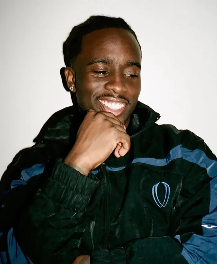 Close-up of Kai Cenat VIVET Debut New York Fashion Week 2026 Fleece Black And Blue Track Jacket