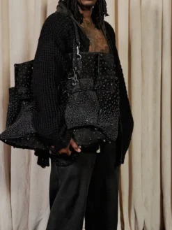 Close-up of Kai Cenat VIVET Debut New York Fashion Week 2026 Open-Knit Black Cardigan Jacket