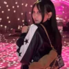 Close-up of Lilas Ikuta Coach Spring 2027 Black And White Star Bomber Leather Jacket