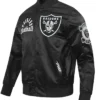 Close-up of NFL Las Vegas Raiders Pro Standard Original Black And White Satin Varsity Jacket