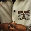 Close-up of New York Knicks 2026 NBA Basketball Champions Off-White Fleece Varsity Jacket