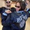 Close-up of Team Tink Dancing with the Stars S35 Maura Higgins Black Satin Starter Varsity Jacket