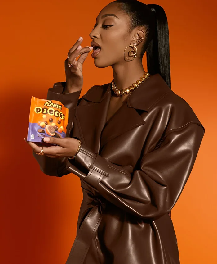 Close-up of WNBA Angel Reese x Reese's Pieces Chocolate Brown Leather Jacket