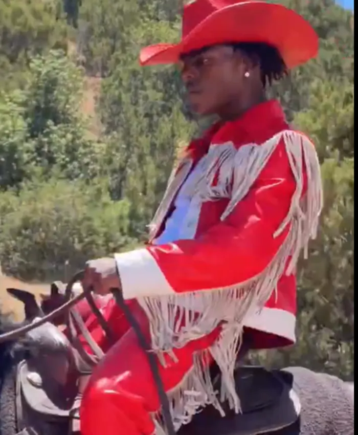 Close view of IShowSpeed KFC Commercial Red And White Leather Western Fringe Jacket