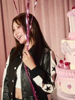 Close view of Lilas Ikuta Coach Spring 2027 Black And White Star Leather Bomber Jacket