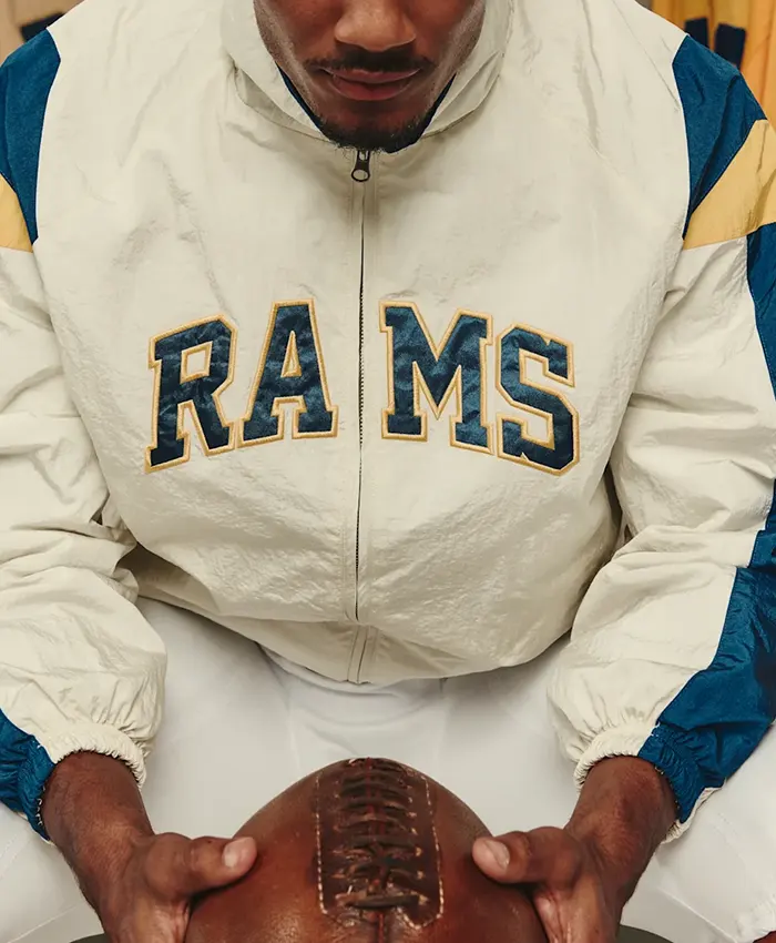 Close view of Los Angeles Rams x Elwood Off-White Retro Blue And Gold Helmet Windbreaker Jacket