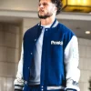 Close view of NFL Los Angeles Rams Blake Corum Arrival Peak Navy And White Varsity Letterman Jacket