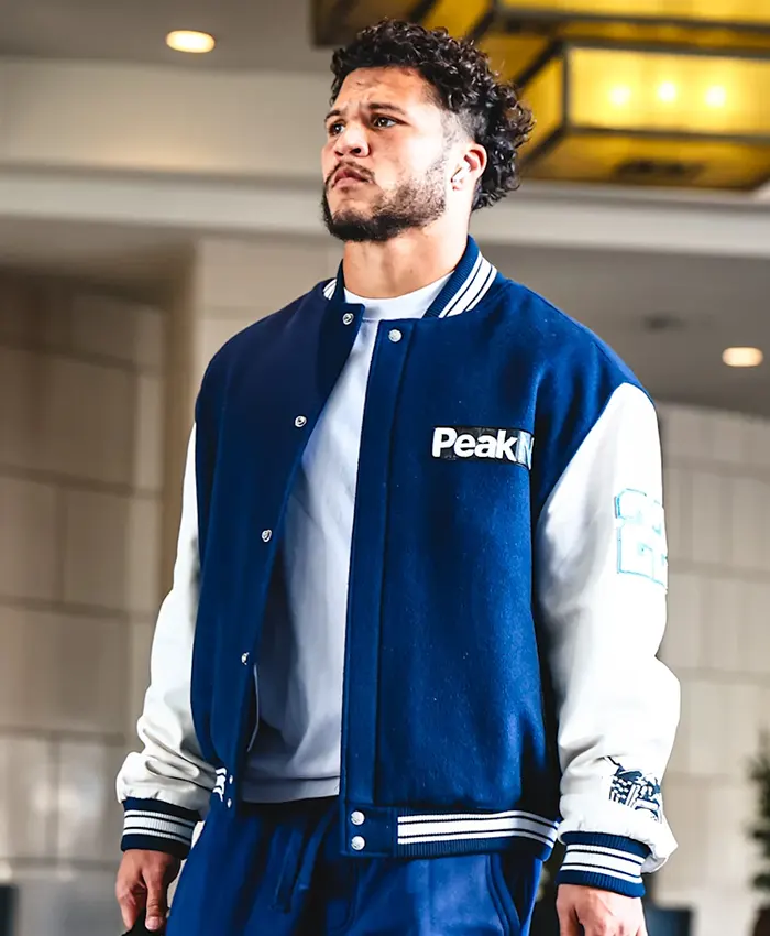 Close view of NFL Los Angeles Rams Blake Corum Arrival Peak Navy And White Varsity Letterman Jacket
