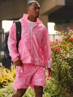 Close view of NFL Philadelphia Eagles Vibrant Pink Polyester Windbreaker Track Jacket Sale