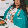 Close view of NFL Team Miami Dolphins Los Delfines de Miami Teal Blue Satin Varsity Jacket