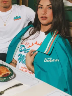 Close view of NFL Team Miami Dolphins Los Delfines de Miami Teal Blue Satin Varsity Jacket