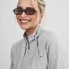 Close view of Prada Spring Show Milan Fashion Week 2027 Emilia Clarke Grey Cotton Jacket