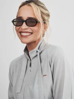 Close view of Prada Spring Show Milan Fashion Week 2027 Emilia Clarke Grey Cotton Jacket