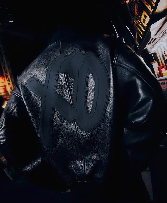 Close view of StupidDOPE x The Weeknd XO logo Black Leather Varsity Bomber Jacket