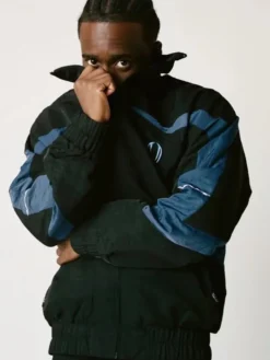 Close view of VIVET Debut New York Fashion Week 2026 Kai Cenat Fleece Black And Blue Track Jacket
