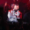 Drake-Surprise-Appearance-at-Taraka-show-Toronto-2026-White-and-Red-Jacket