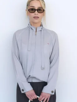 Emilia Clarke Prada Spring Show Milan Fashion Week 2027 Grey Cotton Jacket front view